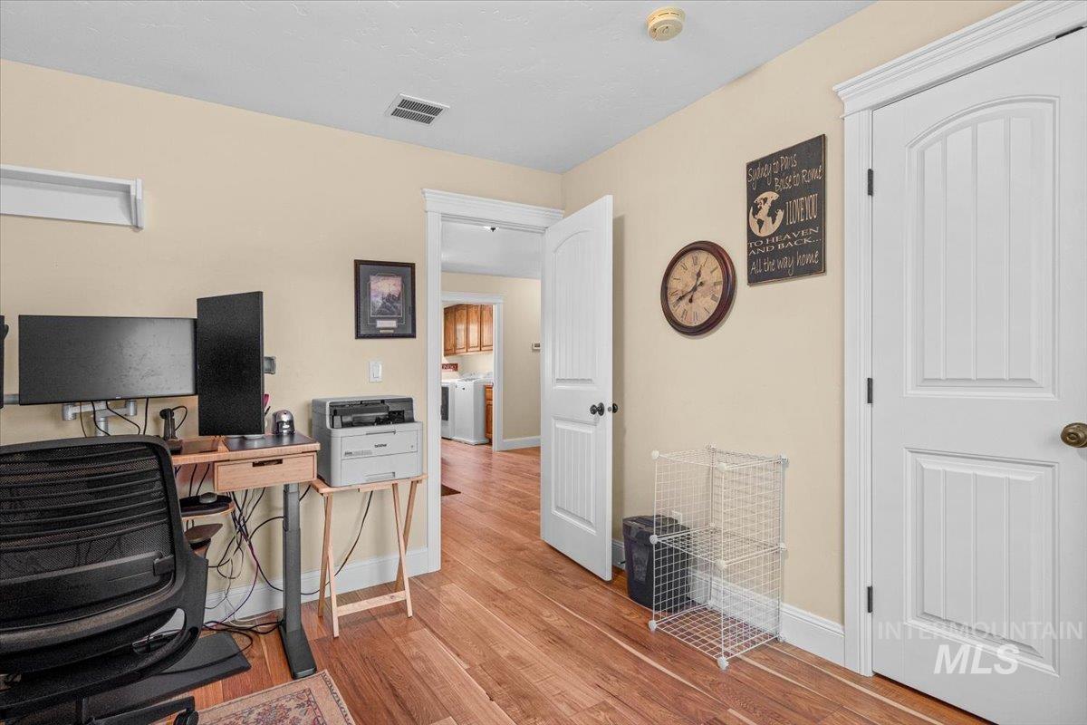 4154 North Tipton Avenue Meridian, ID 83646 - Photo 37 of 50 Room featuring wood-finish flooring and neutral wall tones