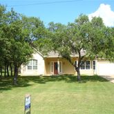 a house with trees in front of it