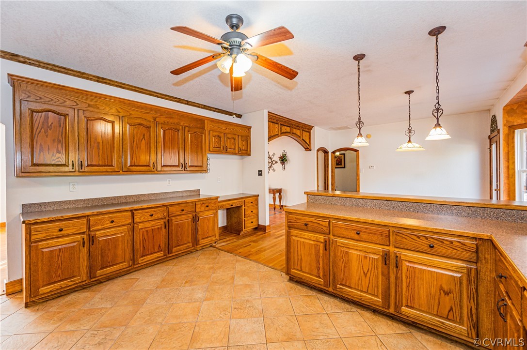 4612 Tatum Road Disputanta, VA 23842 - Photo 12 of 50 a kitchen with stainless steel appliances granite countertop a sink and cabinets with wooden floor