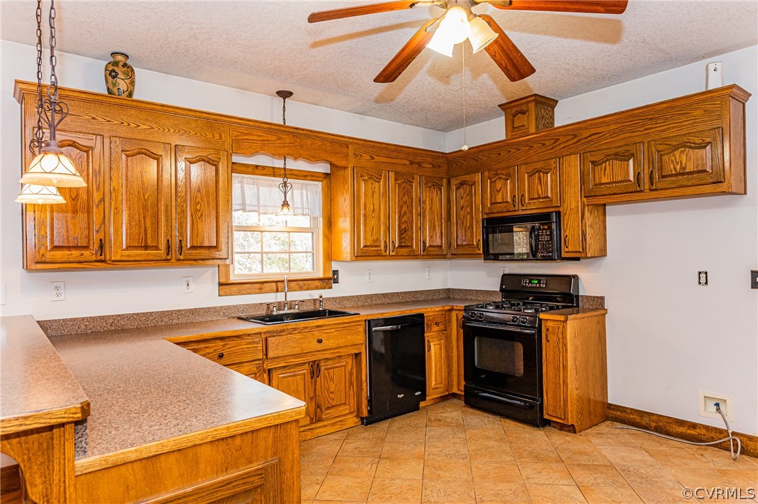 4612 Tatum Road Disputanta, VA 23842 - Photo 14 of 50 a kitchen with stainless steel appliances granite countertop a sink and cabinets