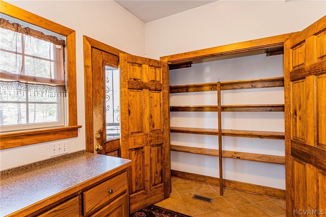 4612 Tatum Road Disputanta, VA 23842 - Photo 17 of 50 a view of walk in closet with empty racks