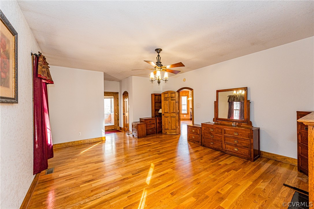 4612 Tatum Road Disputanta, VA 23842 - Photo 20 of 50 a living room with furniture and a chandelier