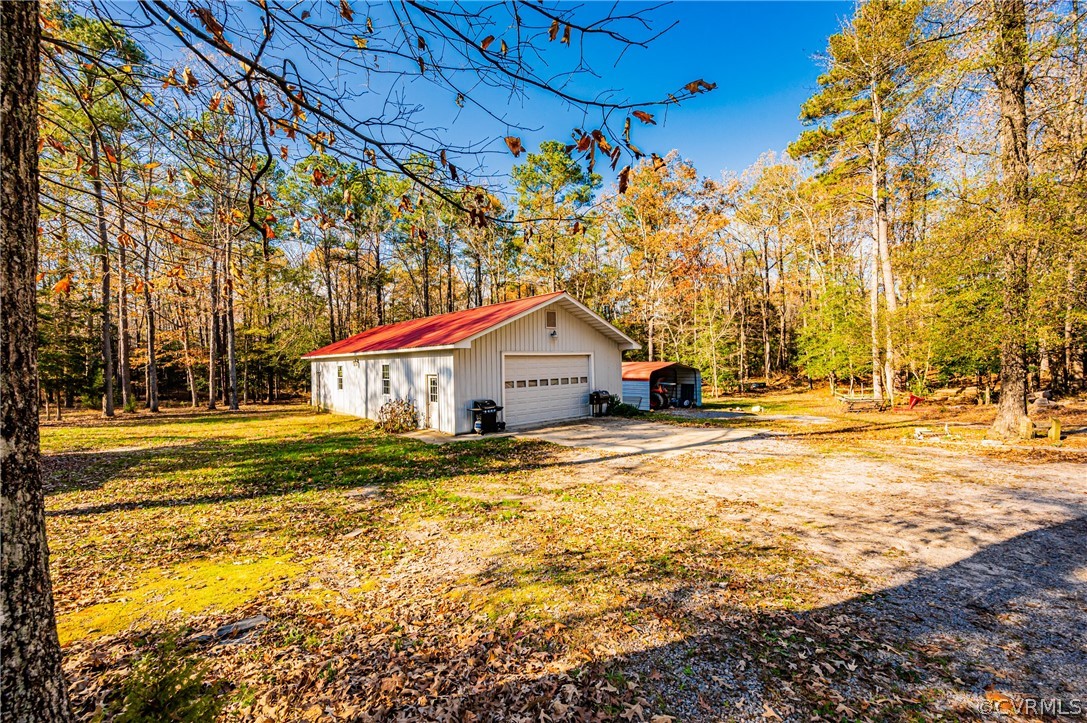 4612 Tatum Road Disputanta, VA 23842 - Photo 2 of 50 a house view with a swimming pool