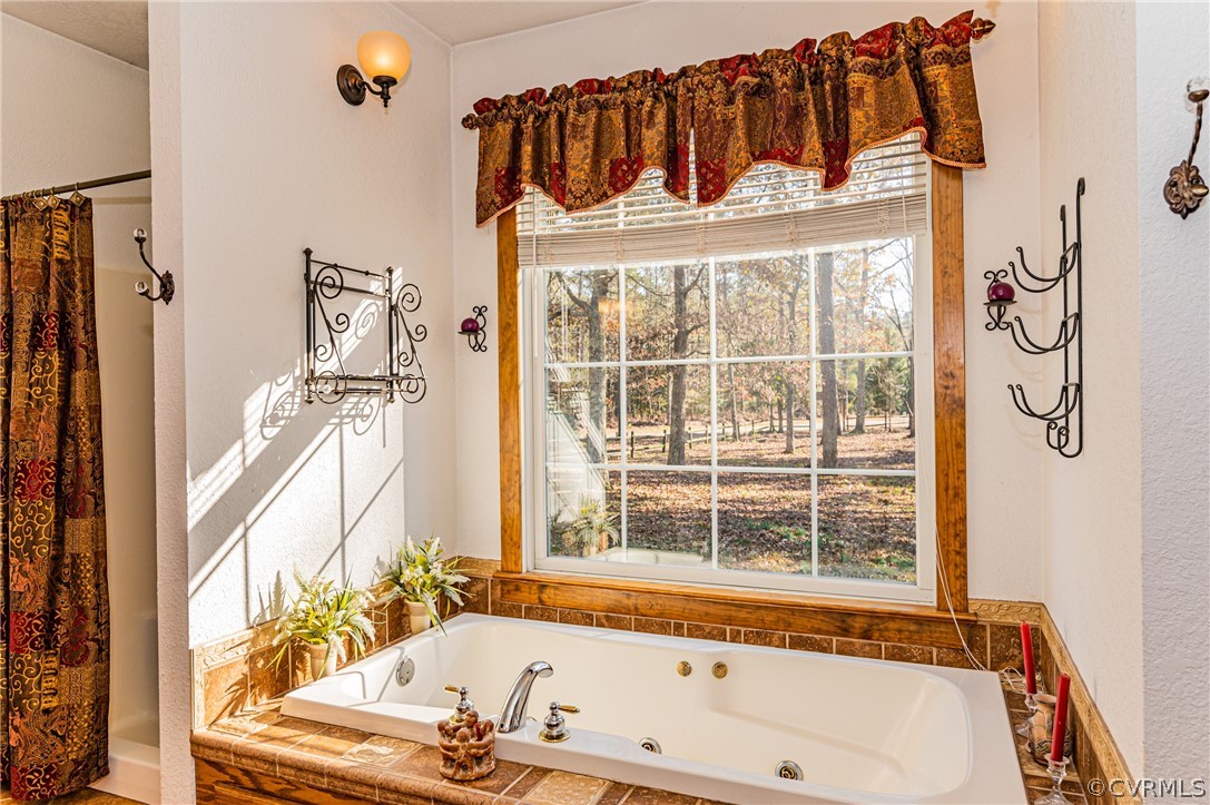 4612 Tatum Road Disputanta, VA 23842 - Photo 27 of 50 a white bath tub sitting next to a window