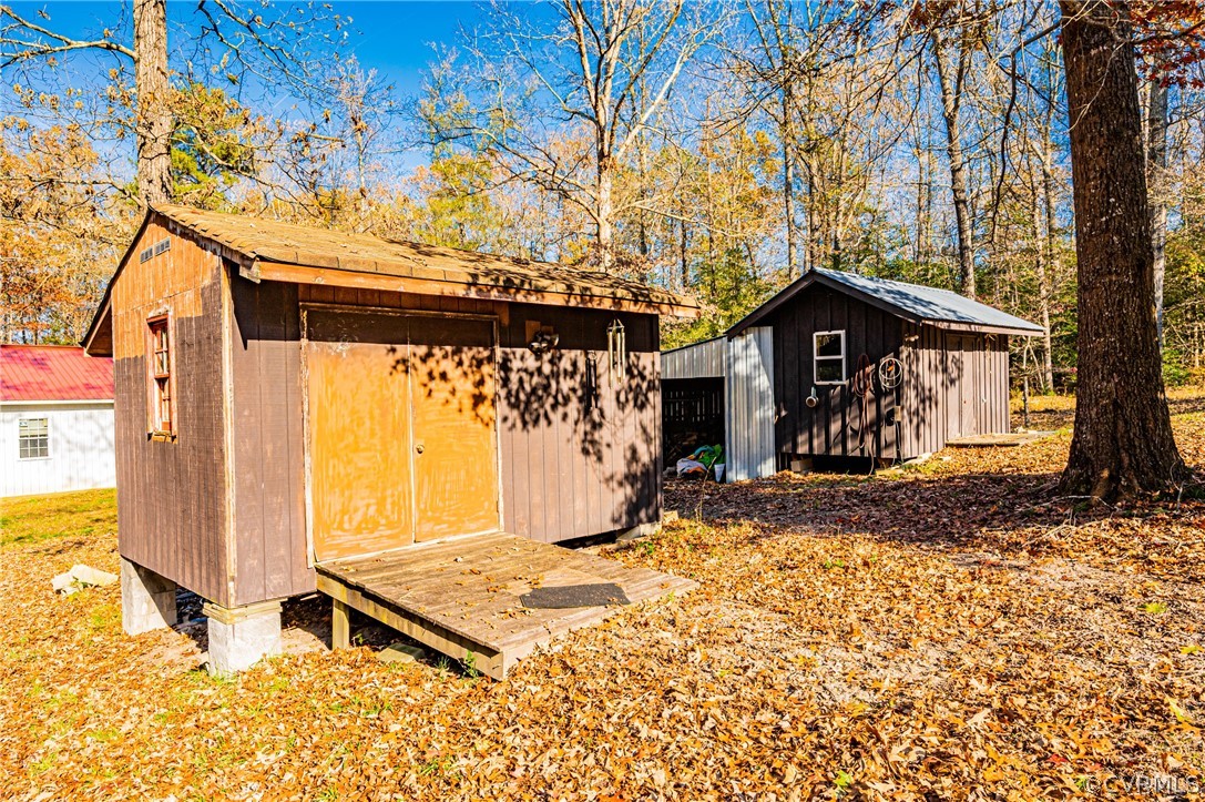 4612 Tatum Road Disputanta, VA 23842 - Photo 42 of 50 a front view of a house with a yard and garage