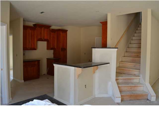 4584 Hermosa Road Crestview, FL 32539 - Photo 11 of 12 a workspace with wooden floor and entryway