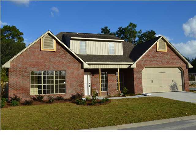 4584 Hermosa Road Crestview, FL 32539 - Photo 2 of 12 a front view of a house with a yard