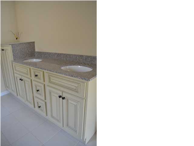 4584 Hermosa Road Crestview, FL 32539 - Photo 9 of 12 a view of a hallway with cabinet