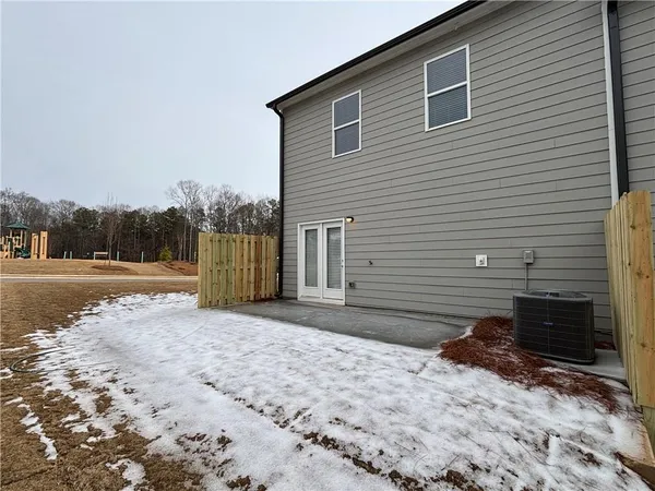 a view of backyard with cabin
