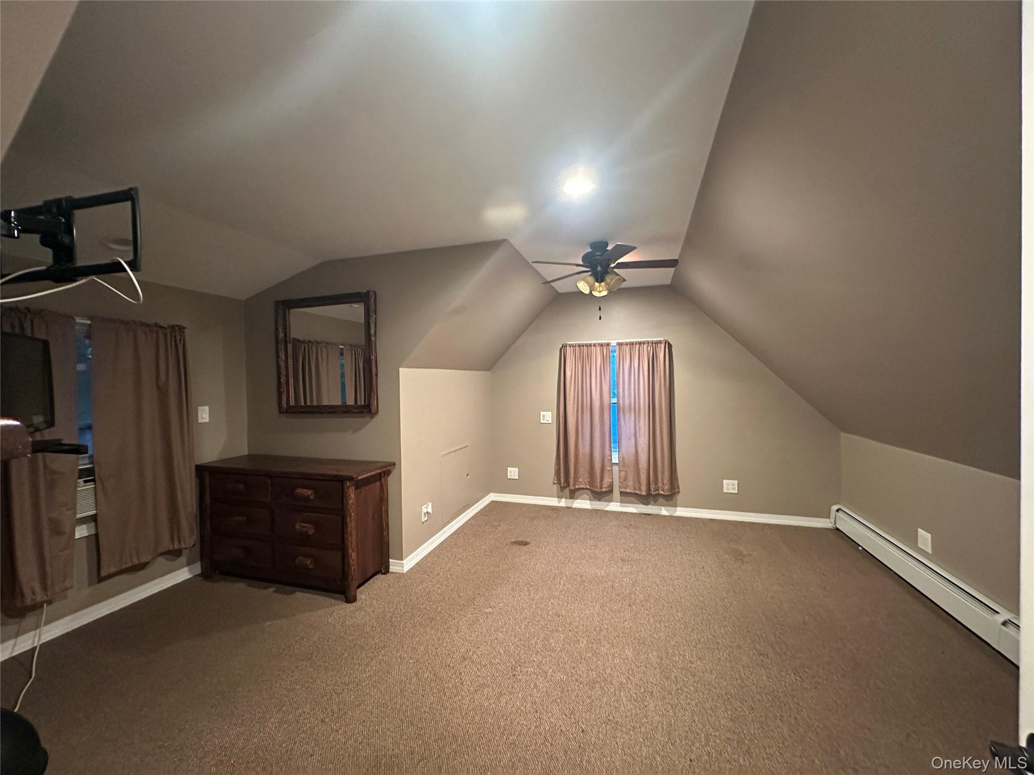 71 Crescent Street Yaphank, NY 11980 - Photo 14 of 22 wooden floor in an empty room with a window