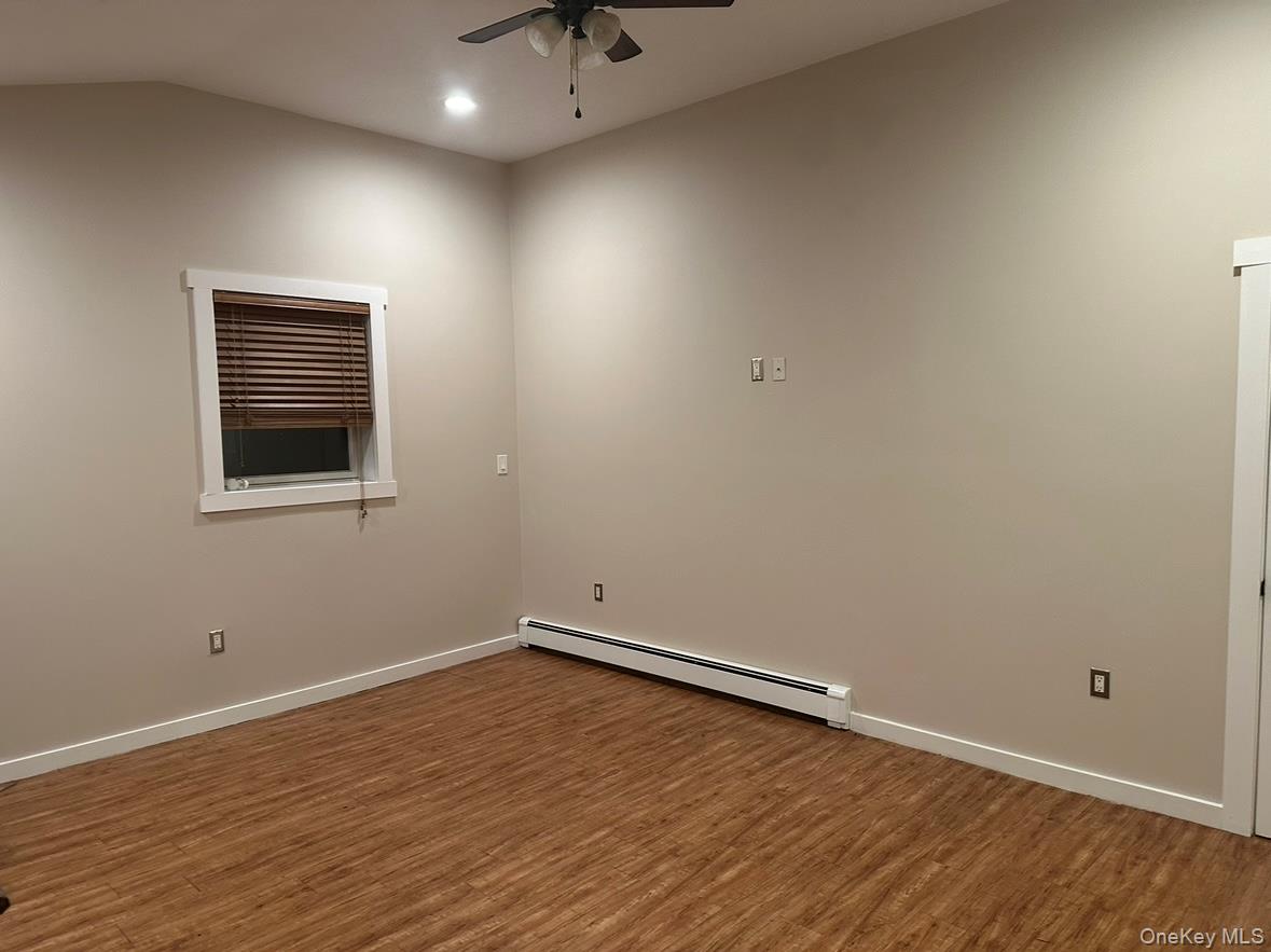 71 Crescent Street Yaphank, NY 11980 - Photo 18 of 22 a view of empty room with wooden floor