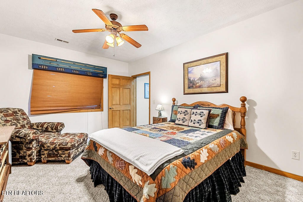 206 Cobblestone Way Townsend, TN 37882 - Photo 35 of 50 a bedroom with a bed and a large window
