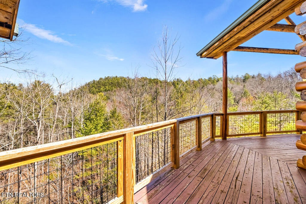 206 Cobblestone Way Townsend, TN 37882 - Photo 39 of 50 a view of a balcony with wooden floor and fence
