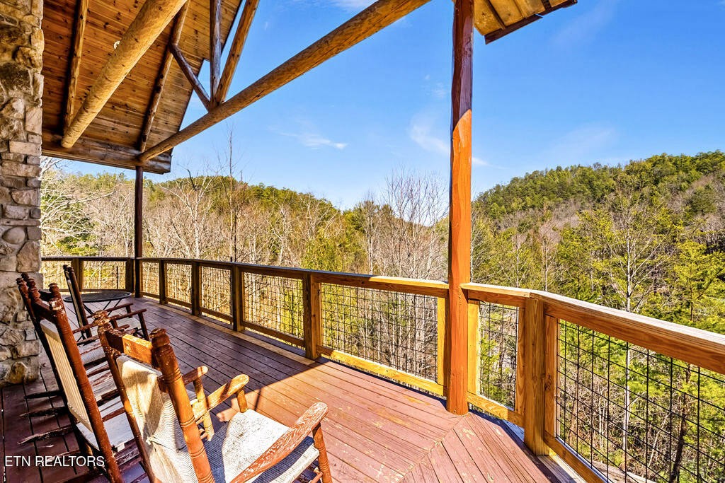 206 Cobblestone Way Townsend, TN 37882 - Photo 42 of 50 a view of a balcony with chairs