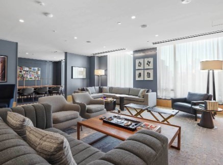 390 Harrison Avenue, Unit 814 Boston, MA 02118 - Photo 11 of 14 a living room with furniture and a large window