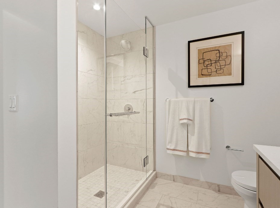 390 Harrison Avenue, Unit 814 Boston, MA 02118 - Photo 6 of 14 a bathroom with a shower and toilet