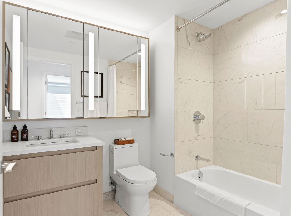 390 Harrison Avenue, Unit 814 Boston, MA 02118 - Photo 8 of 14 a bathroom with a sink toilet vanity and shower