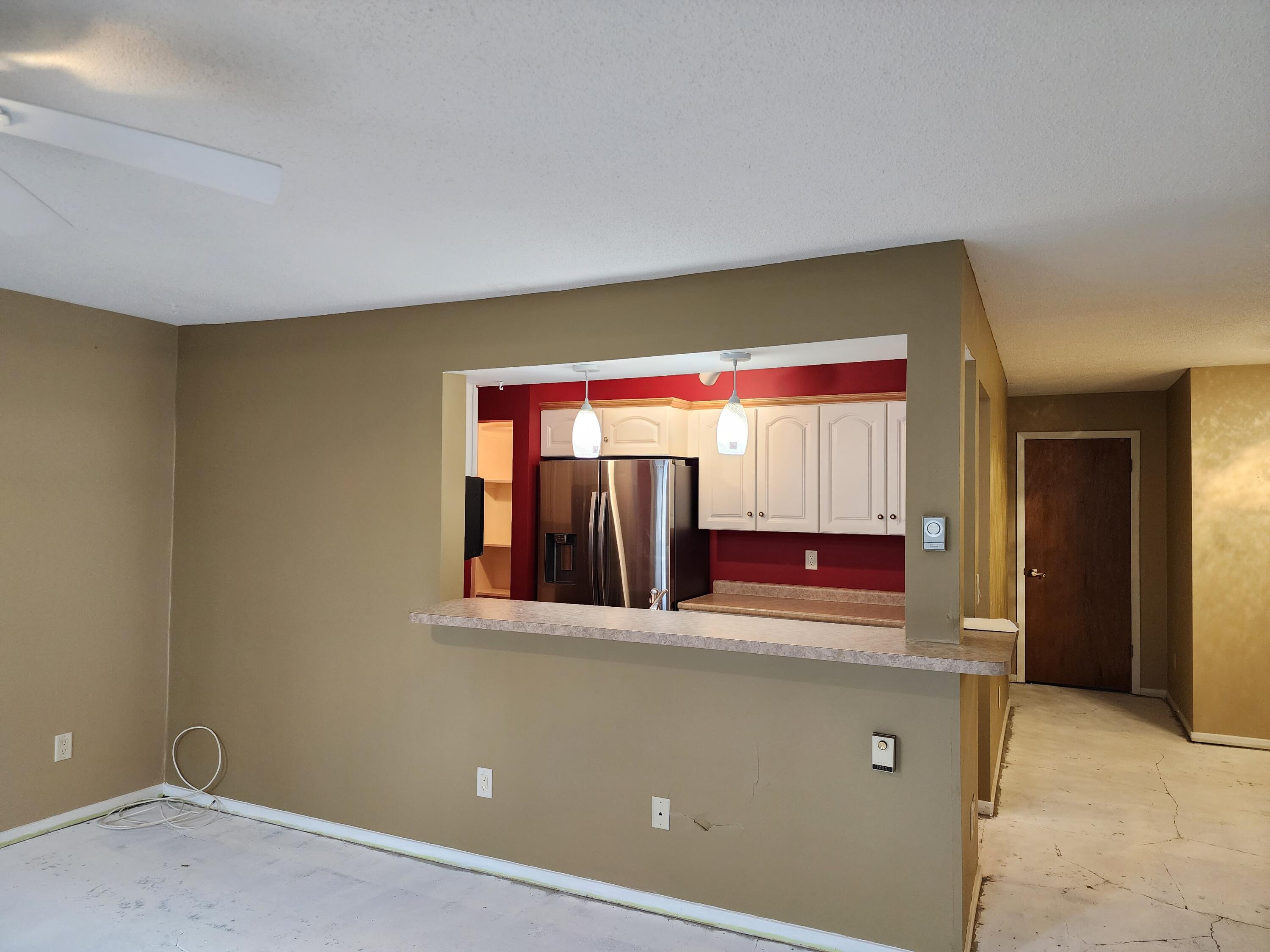 173 East Michigan Avenue, Unit 107A Three Rivers, MI 49093 - Photo 8 of 24 Michigan 173 liv romm and kitchen bar ar