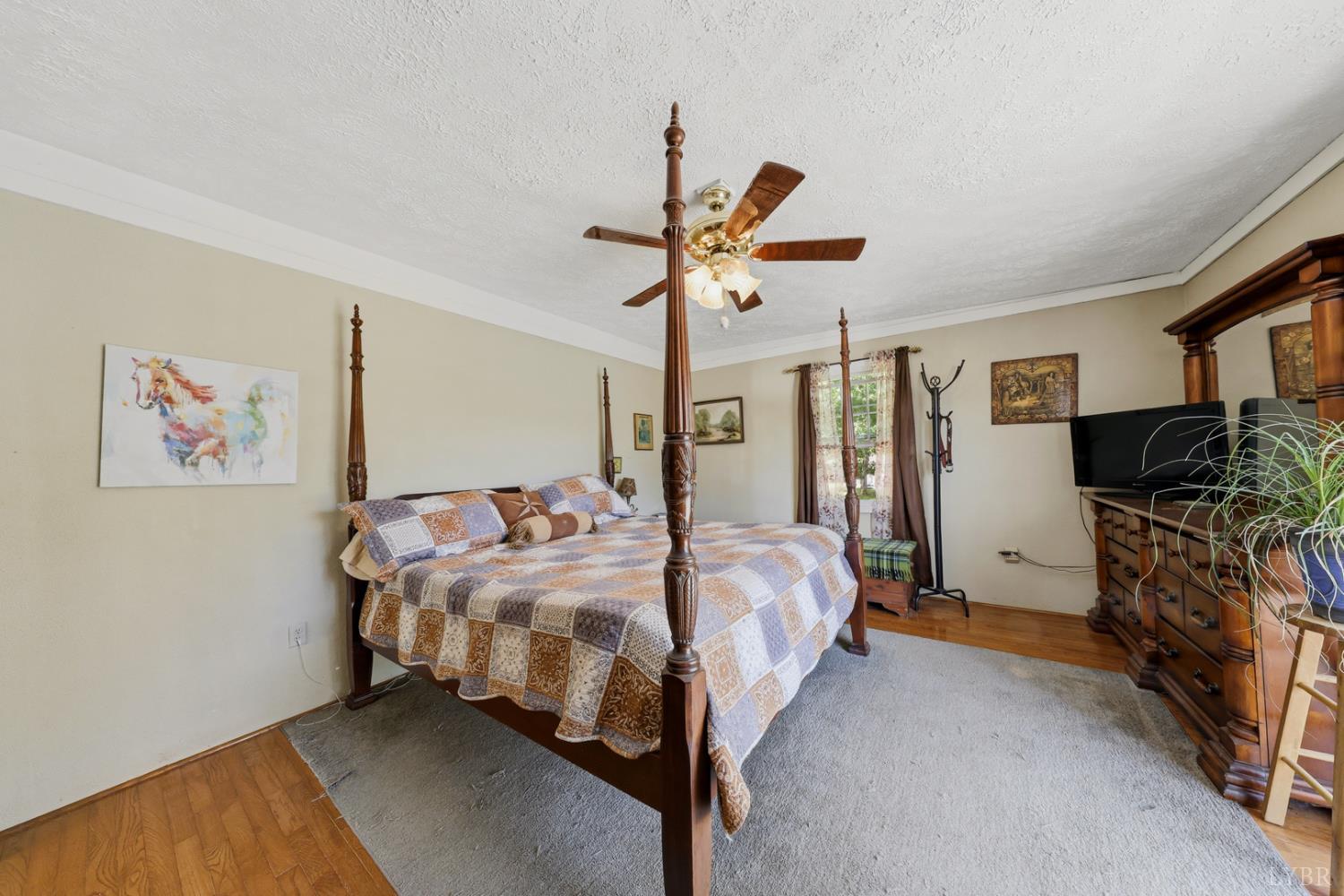 809 Plantation Road Amherst, VA 24521 - Photo 29 of 77 a bed room with a bed and a ceiling fan