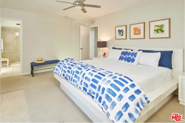 a bedroom with a bed and lamp