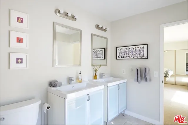 a bathroom with a sink a vanity and a mirror