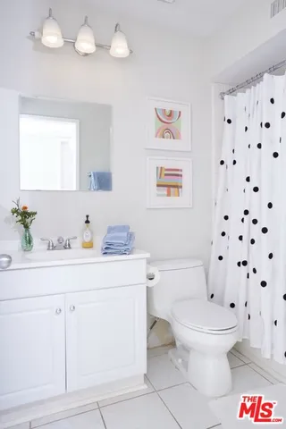 a bathroom with a sink a toilet and a bathtub