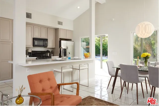 a view of kitchen with dining table and chairs