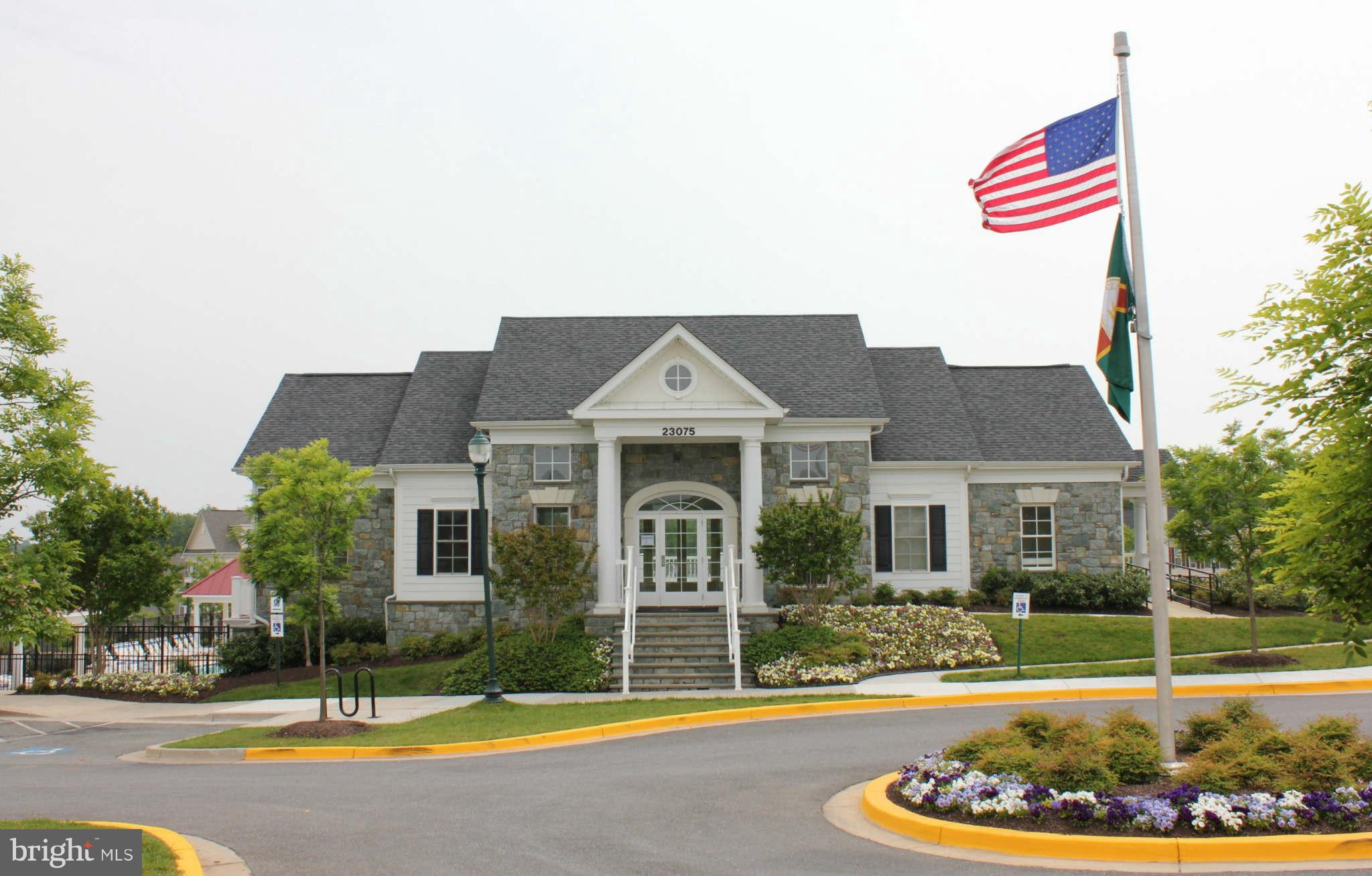 22509 Castle Oak Road Clarksburg, MD 20871 - Photo 3 of 7 a front view of a house with a swimming pool