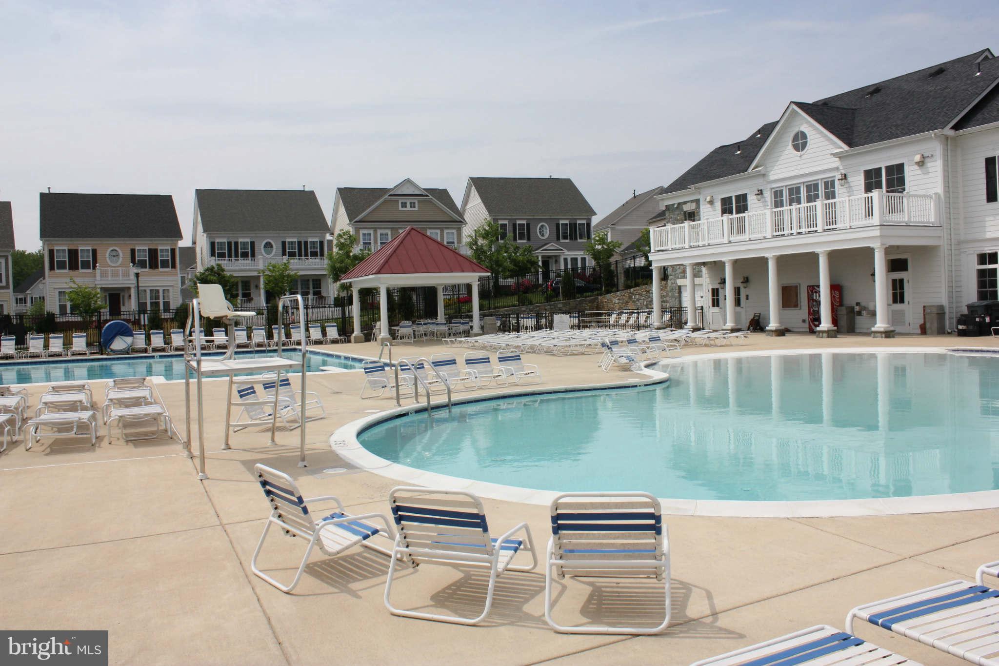 22509 Castle Oak Road Clarksburg, MD 20871 - Photo 5 of 7 a swimming pool with outdoor seating and yard