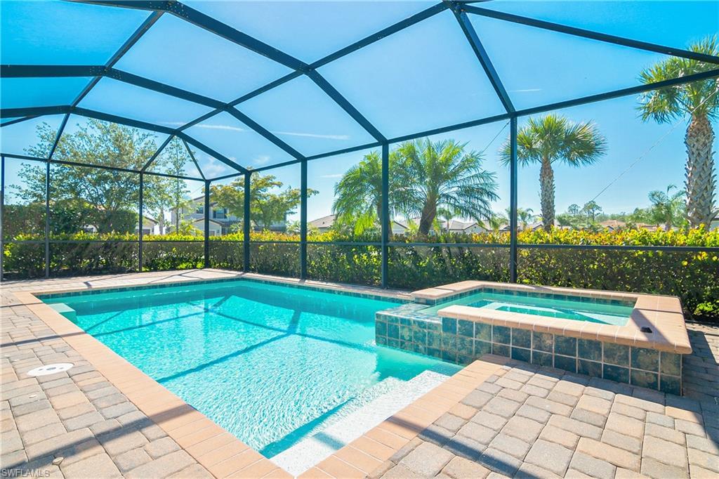 19952 Beverly Park Road Estero, FL 33928 - Photo 19 of 32 a view of a swimming pool with a porch