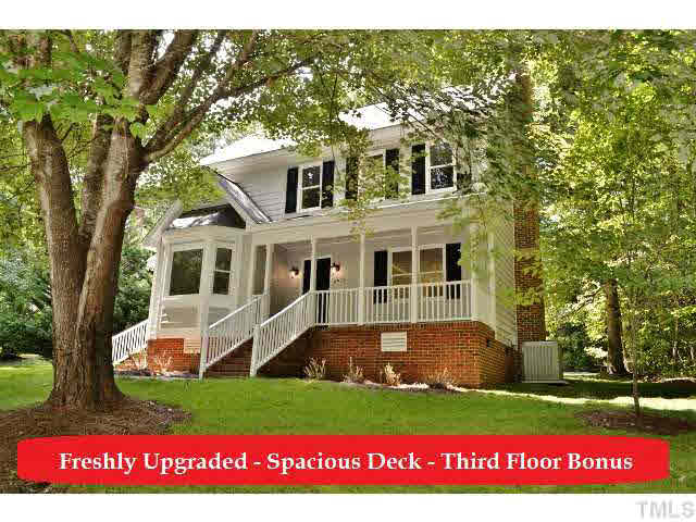 8920 New Windsor Place Raleigh, NC 27603 - Photo 1 of 25 a view of a house with a yard