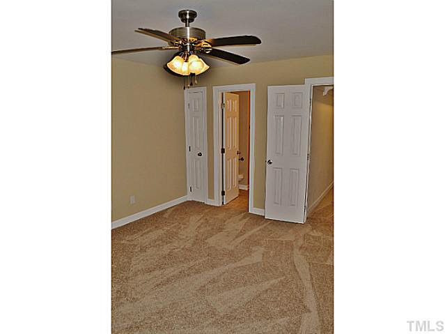 8920 New Windsor Place Raleigh, NC 27603 - Photo 12 of 25 a view of an empty room with a window