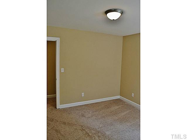 8920 New Windsor Place Raleigh, NC 27603 - Photo 18 of 25 a view of a room with windows