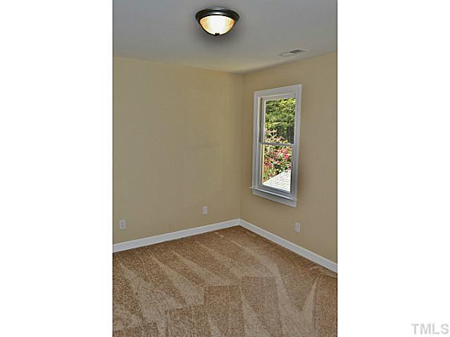 8920 New Windsor Place Raleigh, NC 27603 - Photo 19 of 25 a view of an empty room