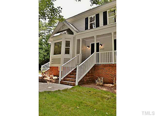 8920 New Windsor Place Raleigh, NC 27603 - Photo 3 of 25 a view of a house with wooden fence