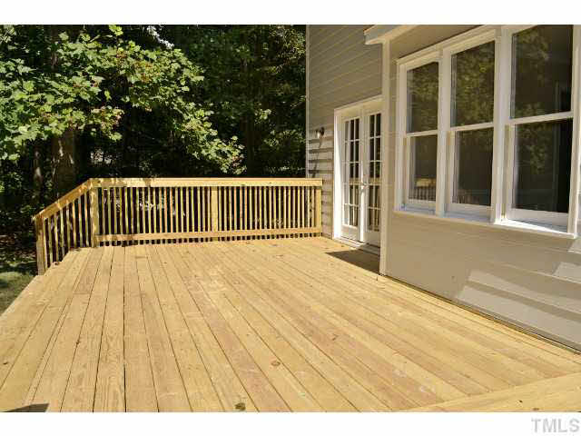 8920 New Windsor Place Raleigh, NC 27603 - Photo 22 of 25 a view of balcony with wooden floor