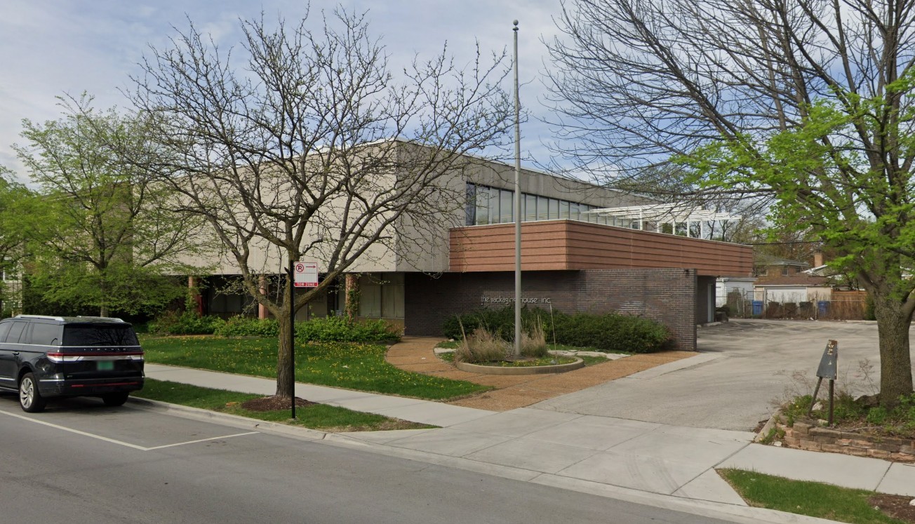 6330 North Pulaski Road Chicago, IL 60646 - Photo 2 of 3 a front view of a house with a garden and trees