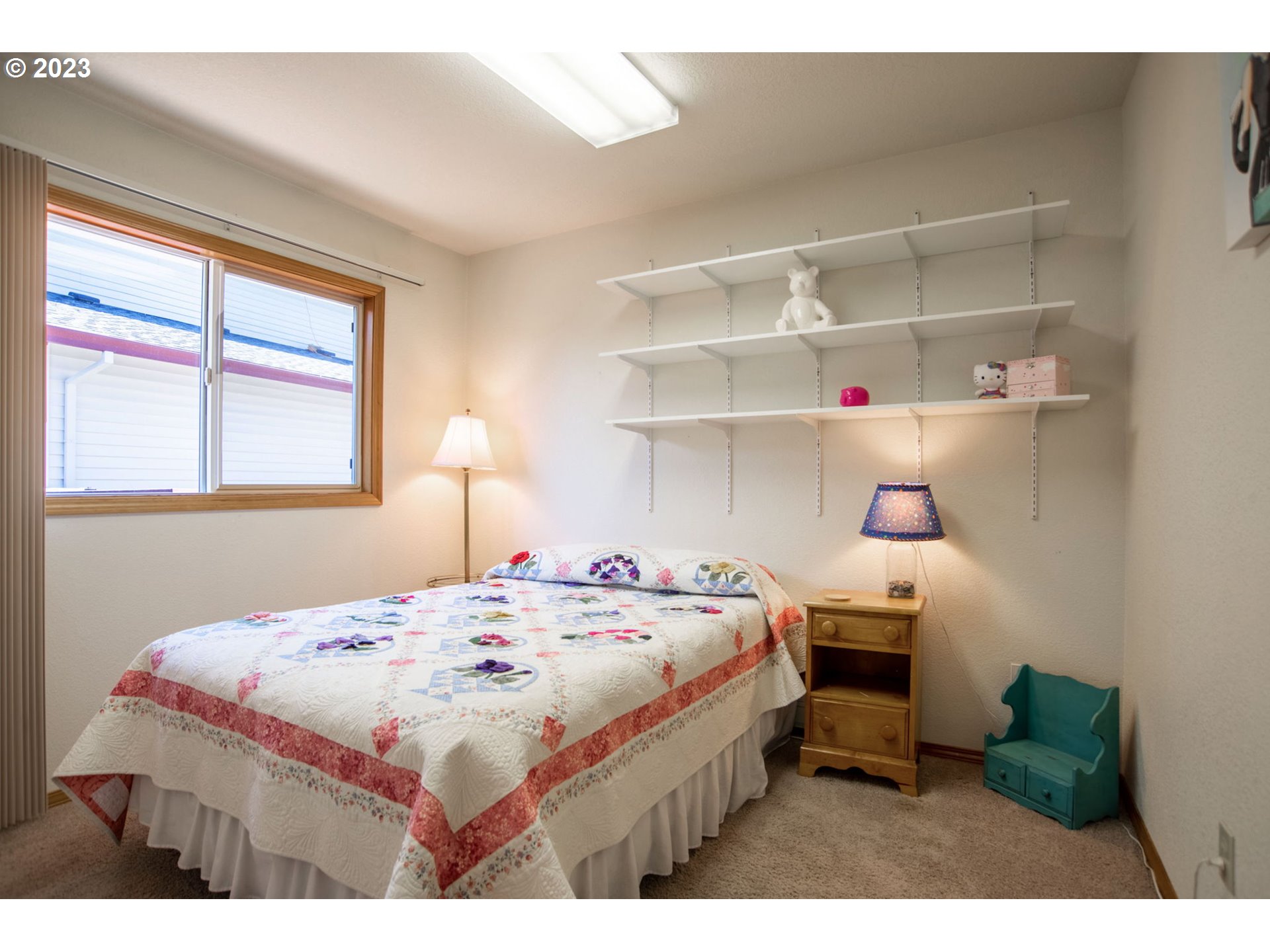 760 Northeast 24th Street Gresham, OR 97030 - Photo 20 of 34 a bedroom with a bed and a window