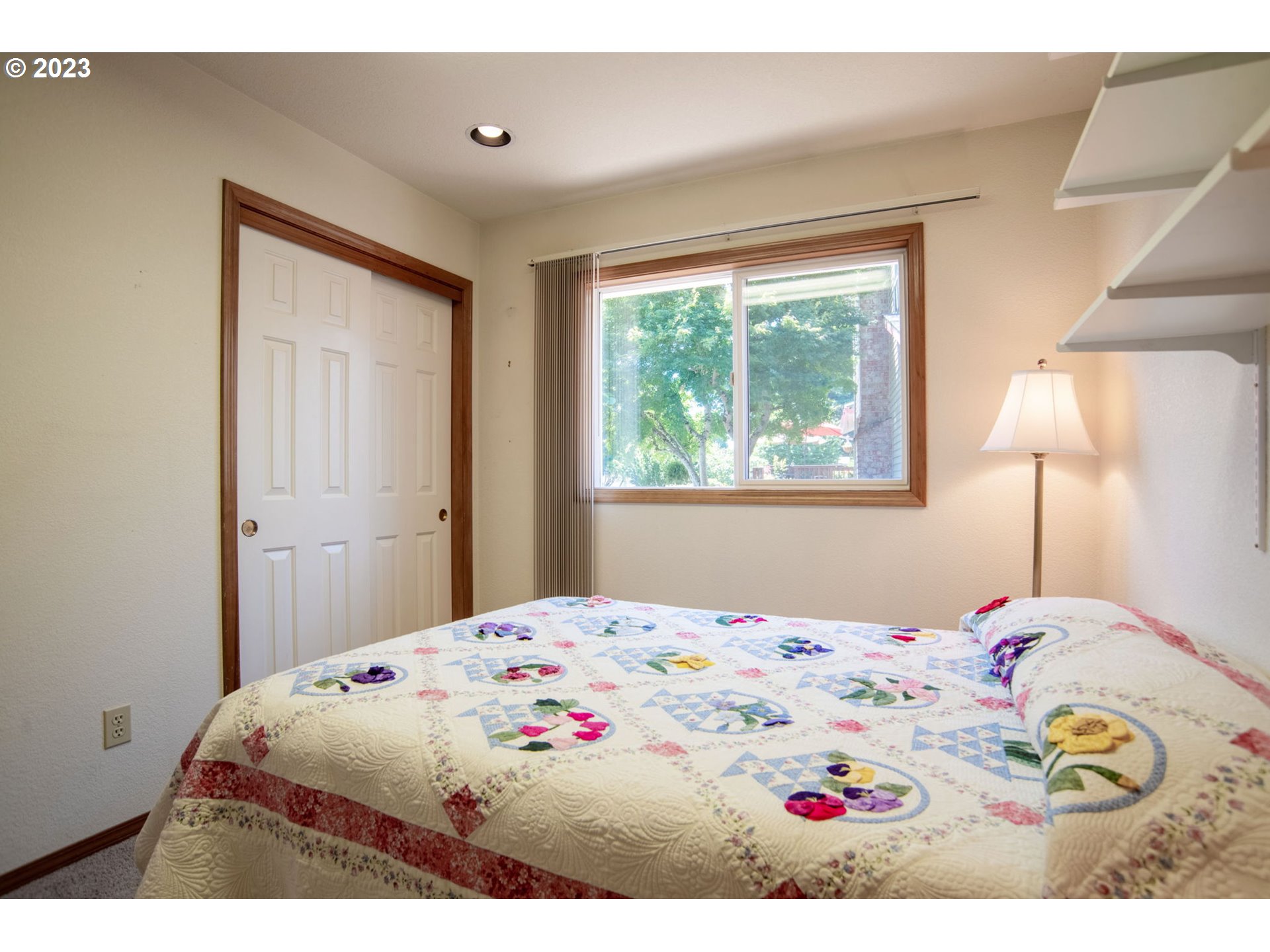 760 Northeast 24th Street Gresham, OR 97030 - Photo 21 of 34 a bedroom with a bed and a painting on the wall