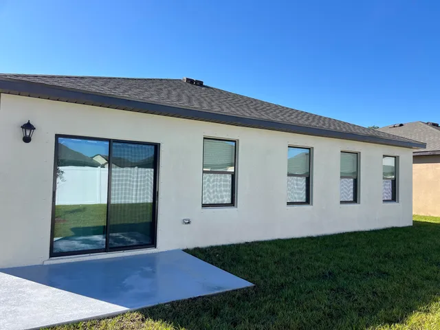 a room with lots of chairs and mirrors