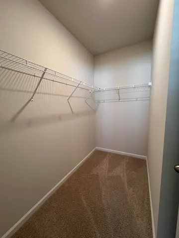 a bathroom with a double vanity sink toilet and mirror