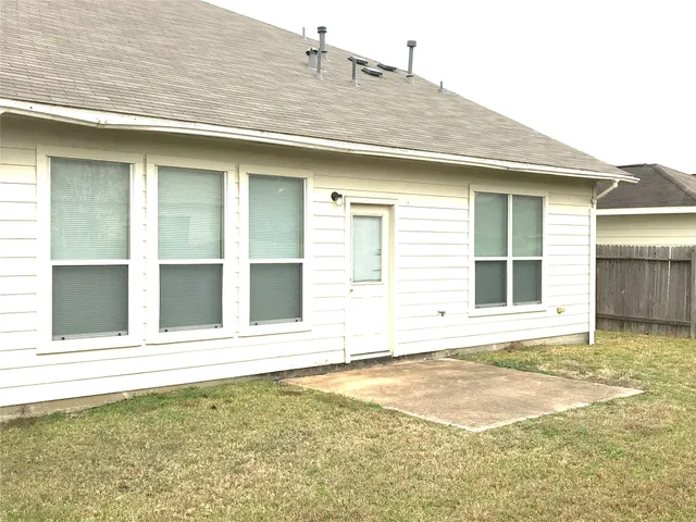 a view of a backyard of a house