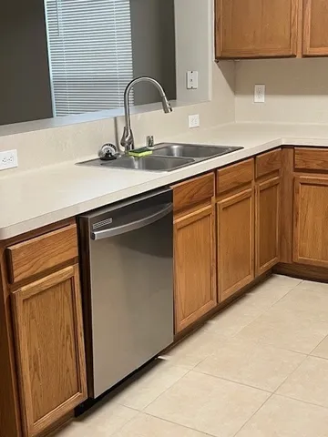 a kitchen with a sink and cabinets