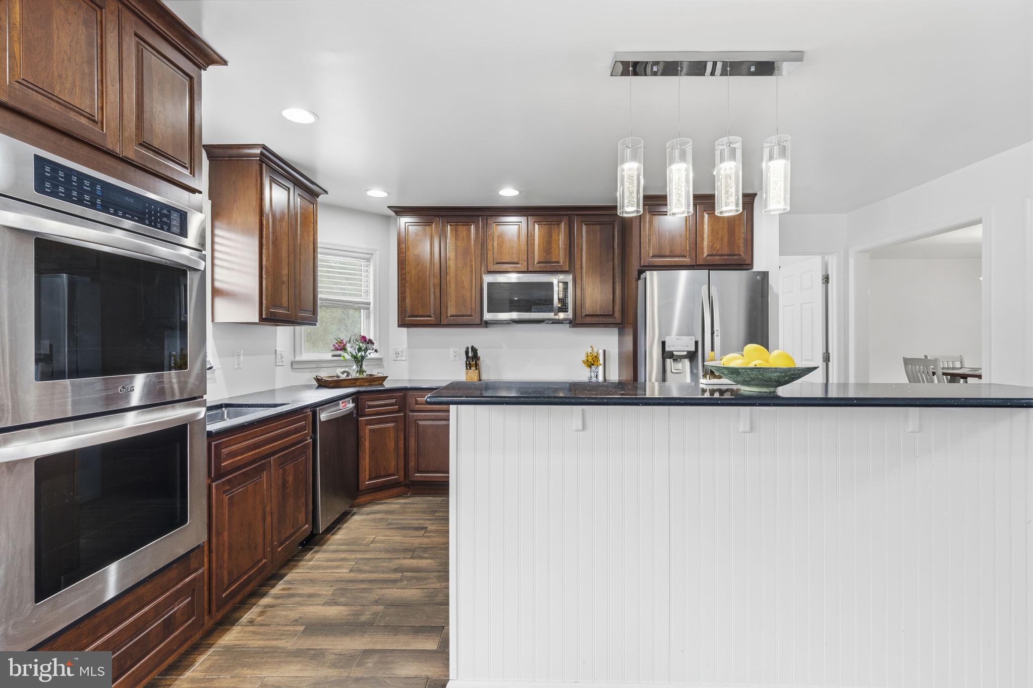 65 Watters Road New Park, PA 17352 - Photo 16 of 52 Modern kitchen with rich wood accents.