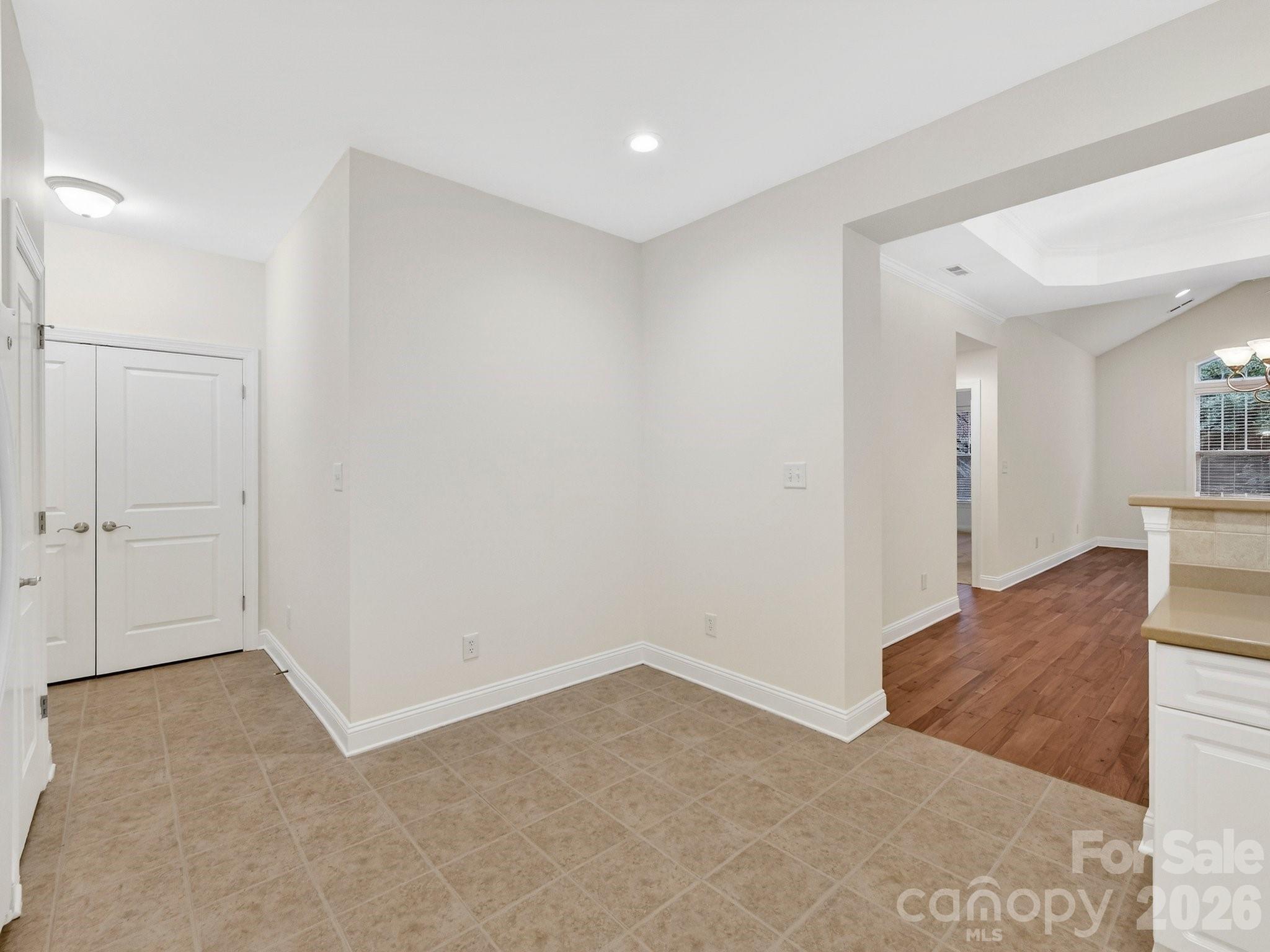 2963 Bellasera Way Matthews, NC 28105 - Photo 17 of 45 a view of a kitchen cabinets and empty room