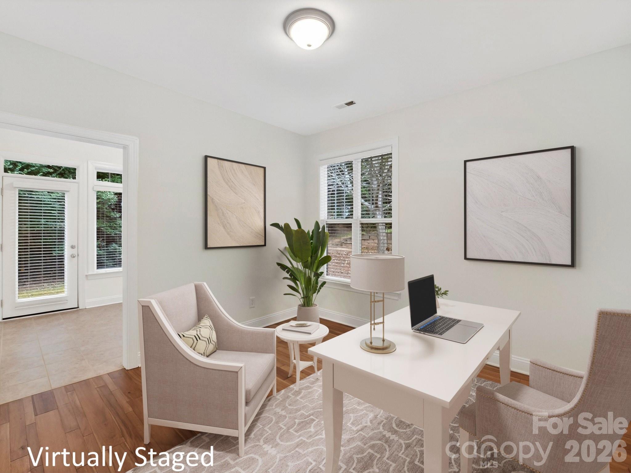 2963 Bellasera Way Matthews, NC 28105 - Photo 19 of 45 a view of a workspace with furniture and bathroom