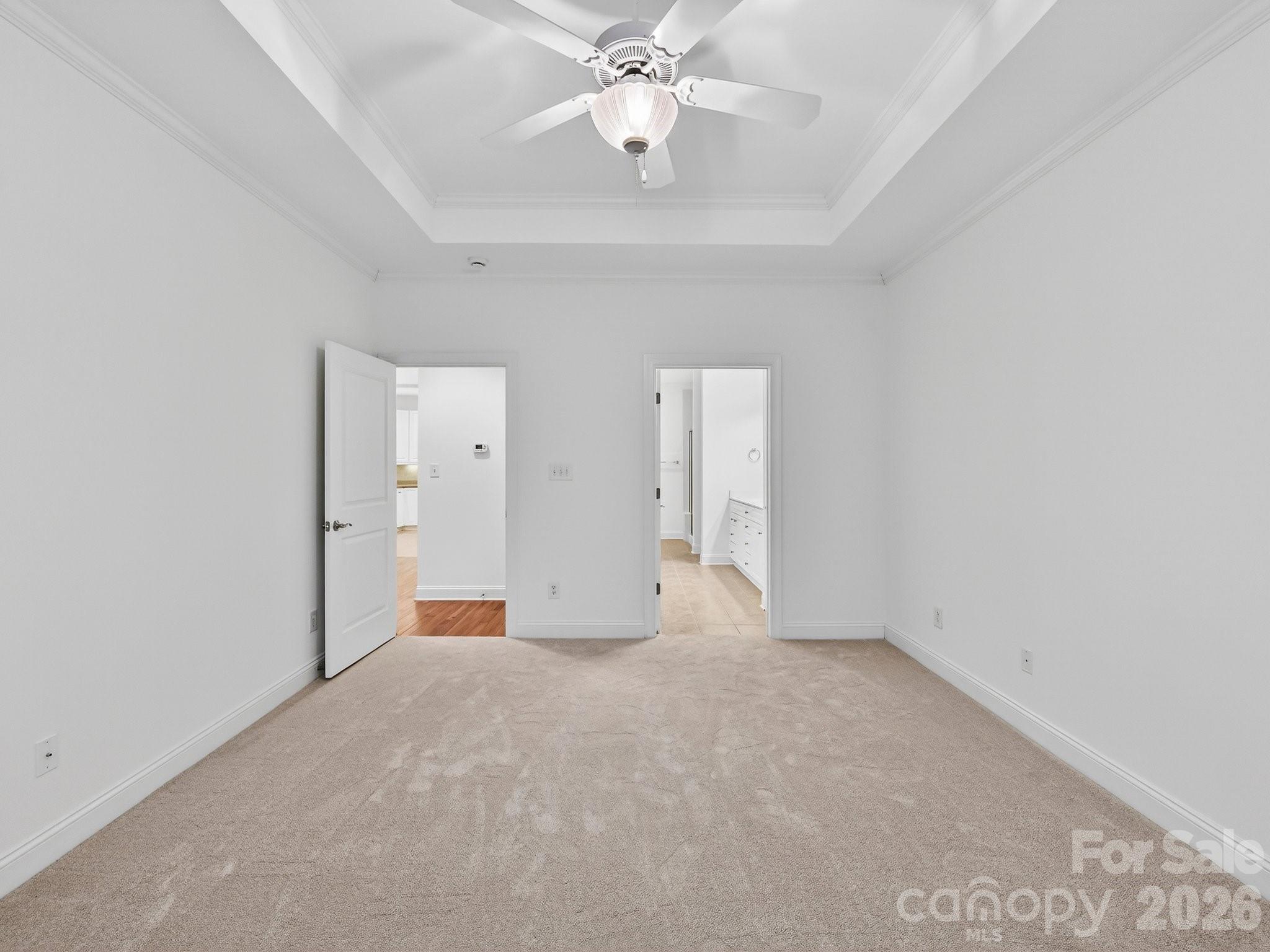 2963 Bellasera Way Matthews, NC 28105 - Photo 24 of 45 wooden floor in an empty room with a chandelier fan