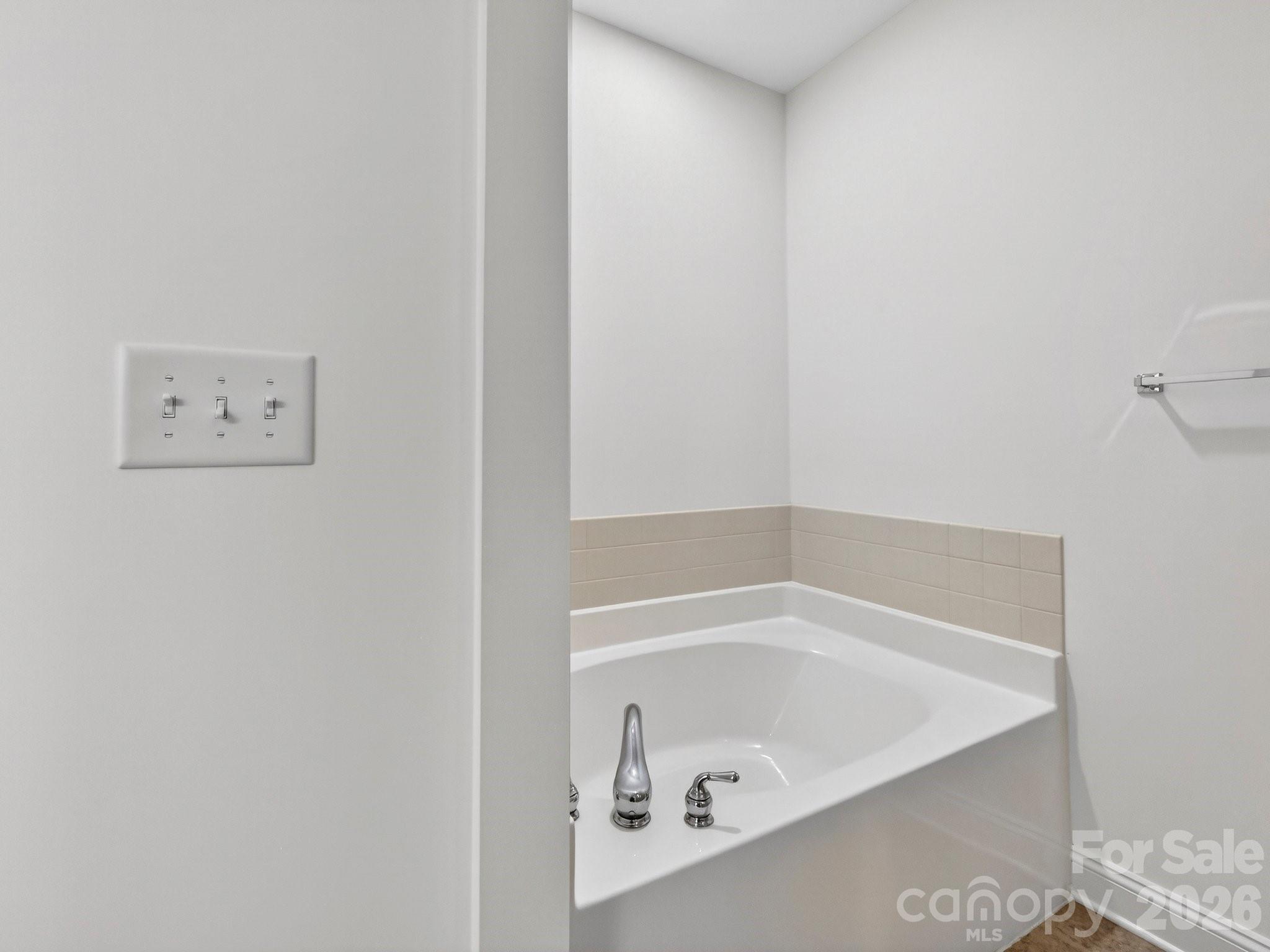 2963 Bellasera Way Matthews, NC 28105 - Photo 26 of 45 a bathroom with a bathtub