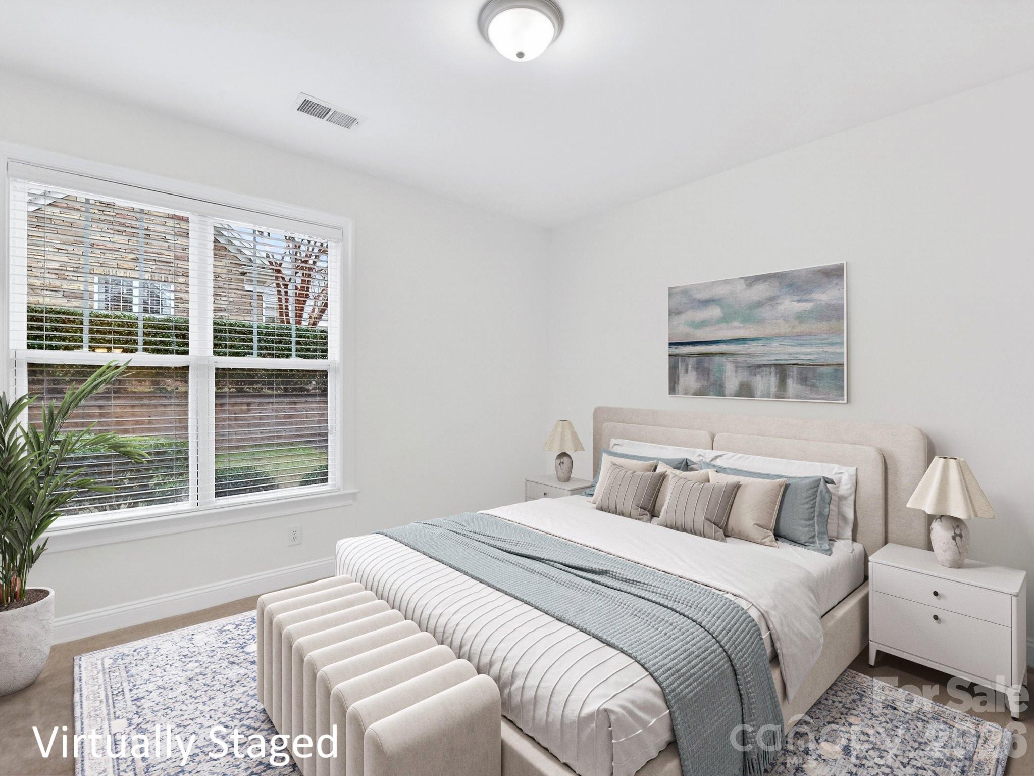 2963 Bellasera Way Matthews, NC 28105 - Photo 30 of 45 a bedroom with a bed and a large window