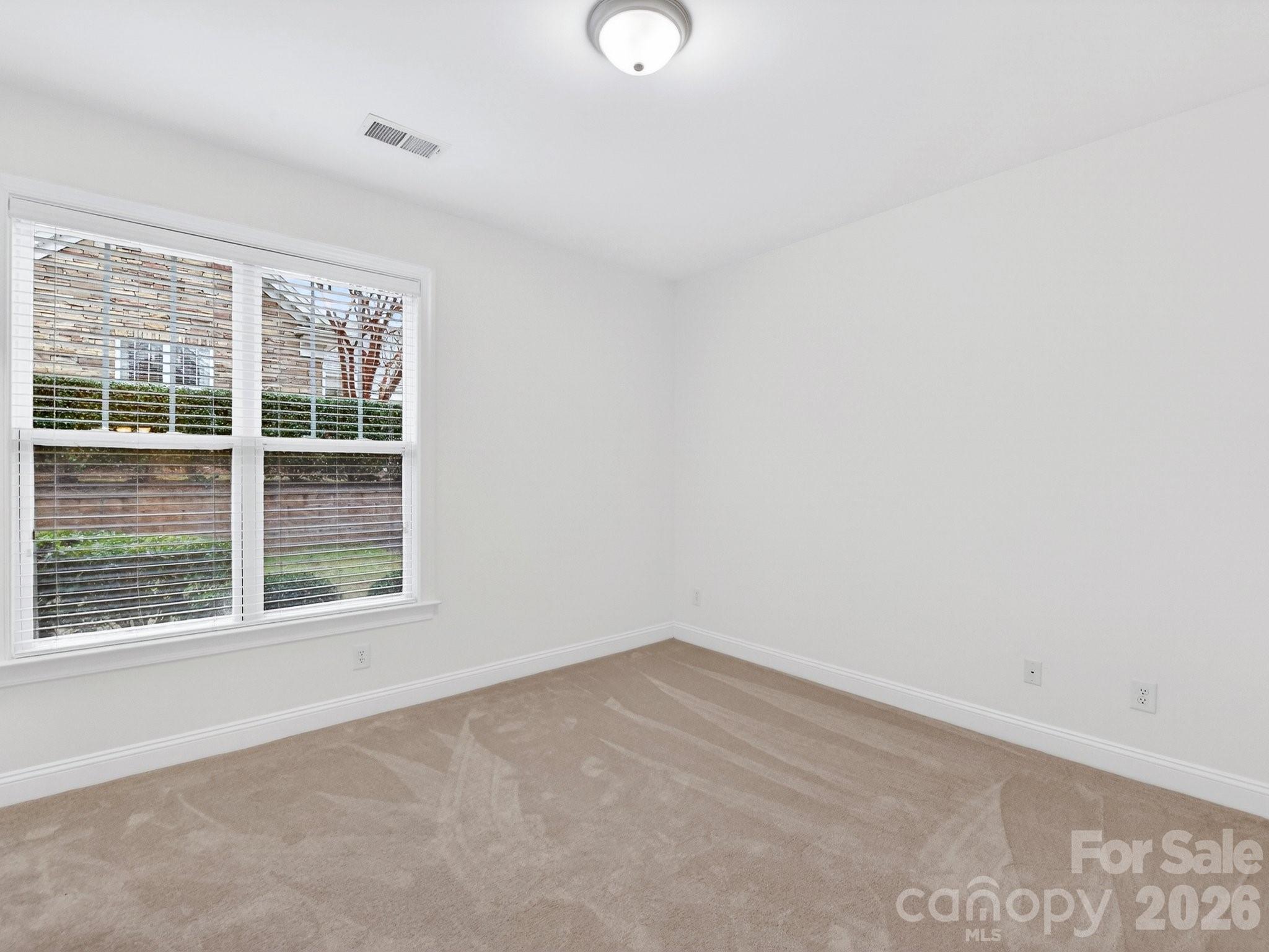 2963 Bellasera Way Matthews, NC 28105 - Photo 31 of 45 an empty room with a window